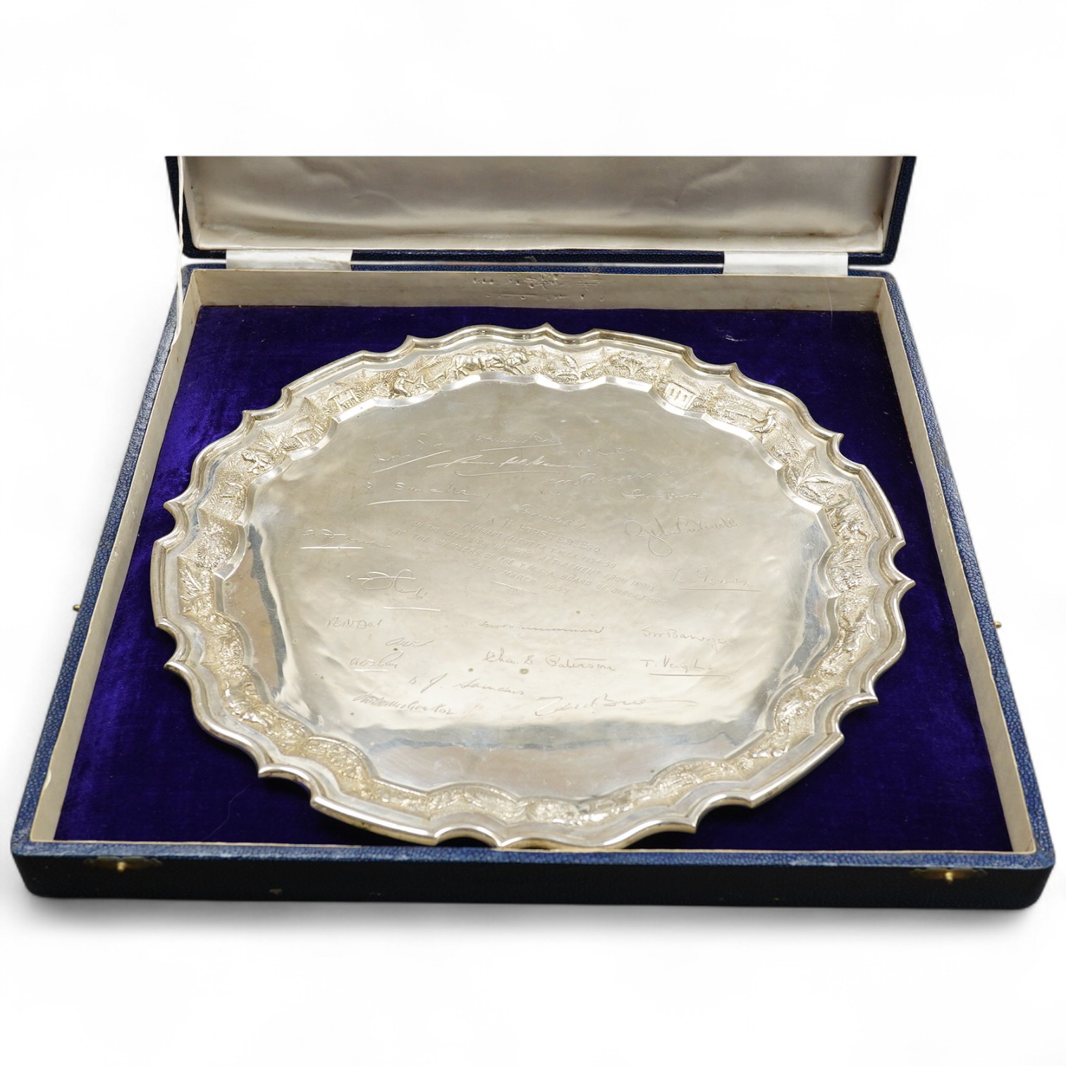 A mid 20th century Indian white metal (stamped sterling silver) presentation salver, engraved with numerous signatures, diameter 35.6cm, 36.8oz, with box.